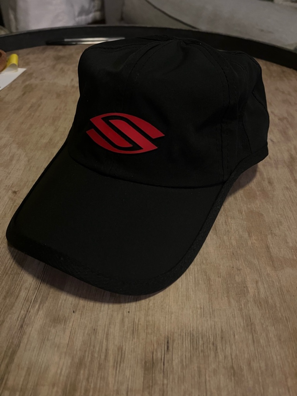 Black Performance Cap with Red Logo